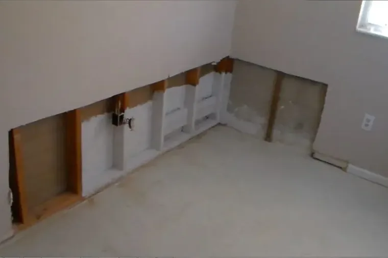 Lower drywall cut away so the wall cavities can dry